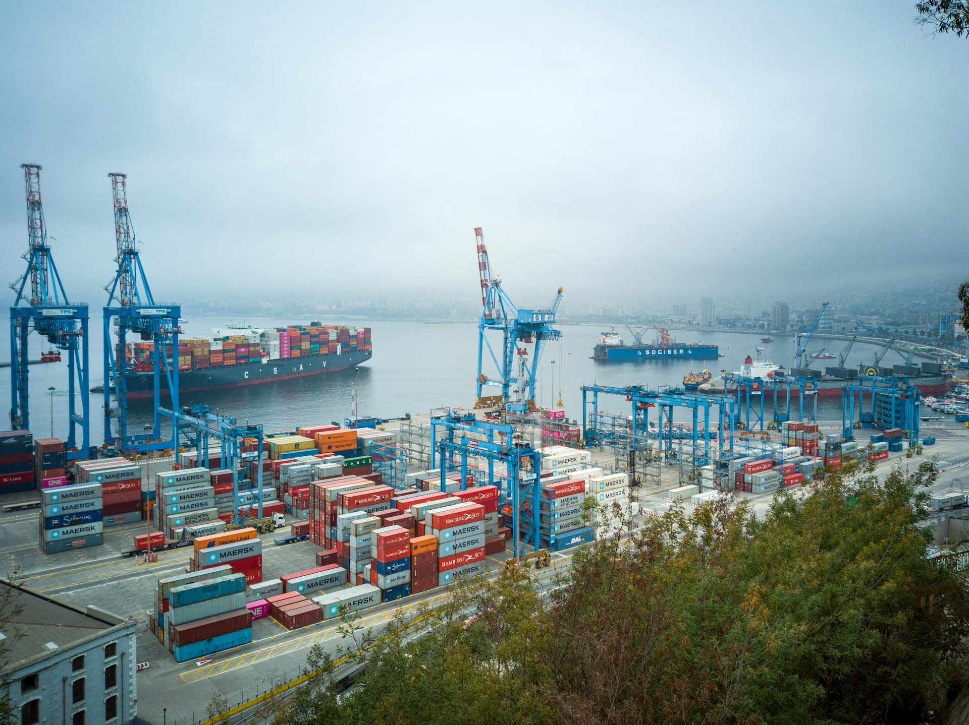 Container port with cranes at dusk